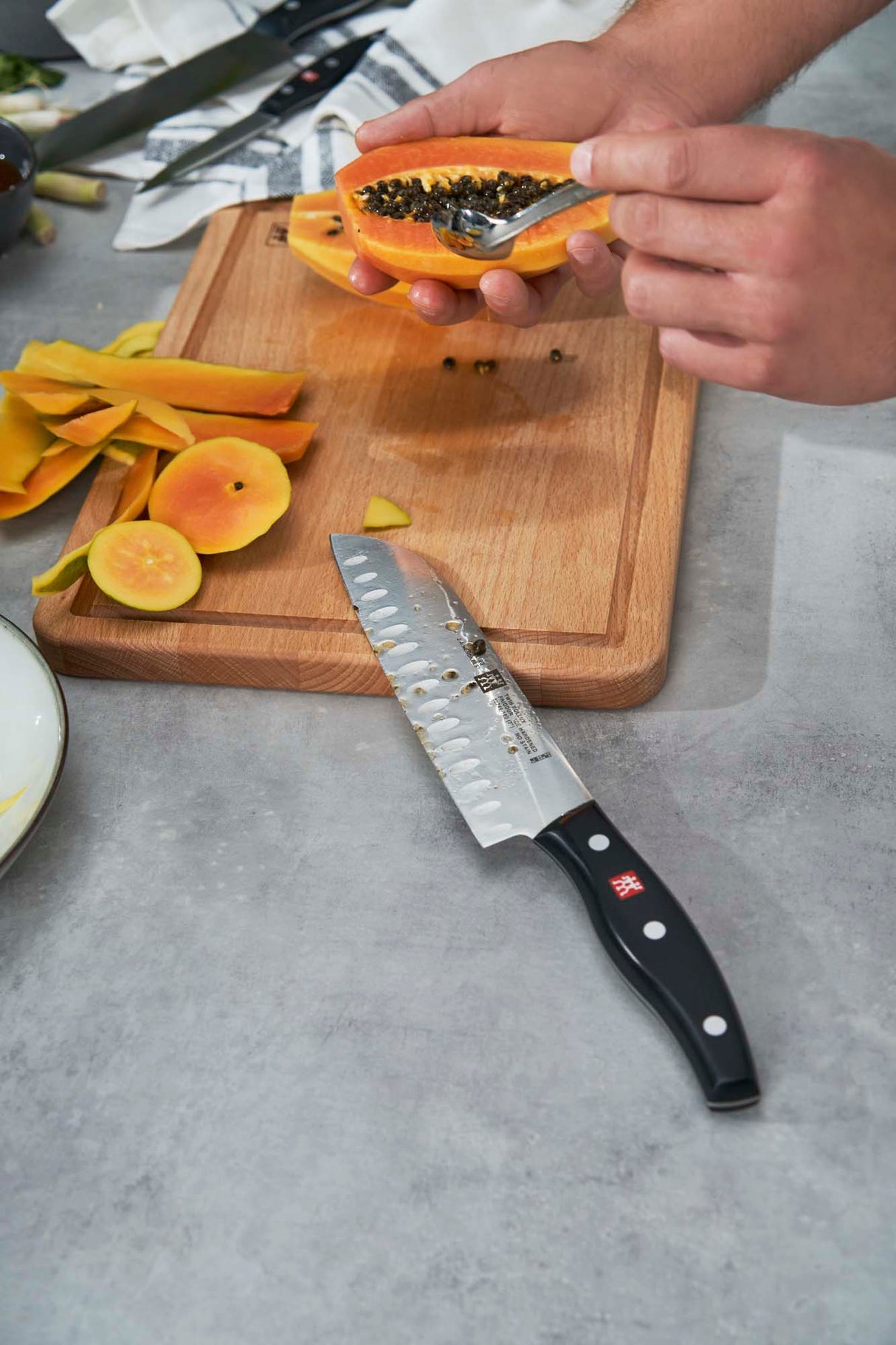 Zwilling Twin Signature 7-inch Hollow Edge Santoku Knife