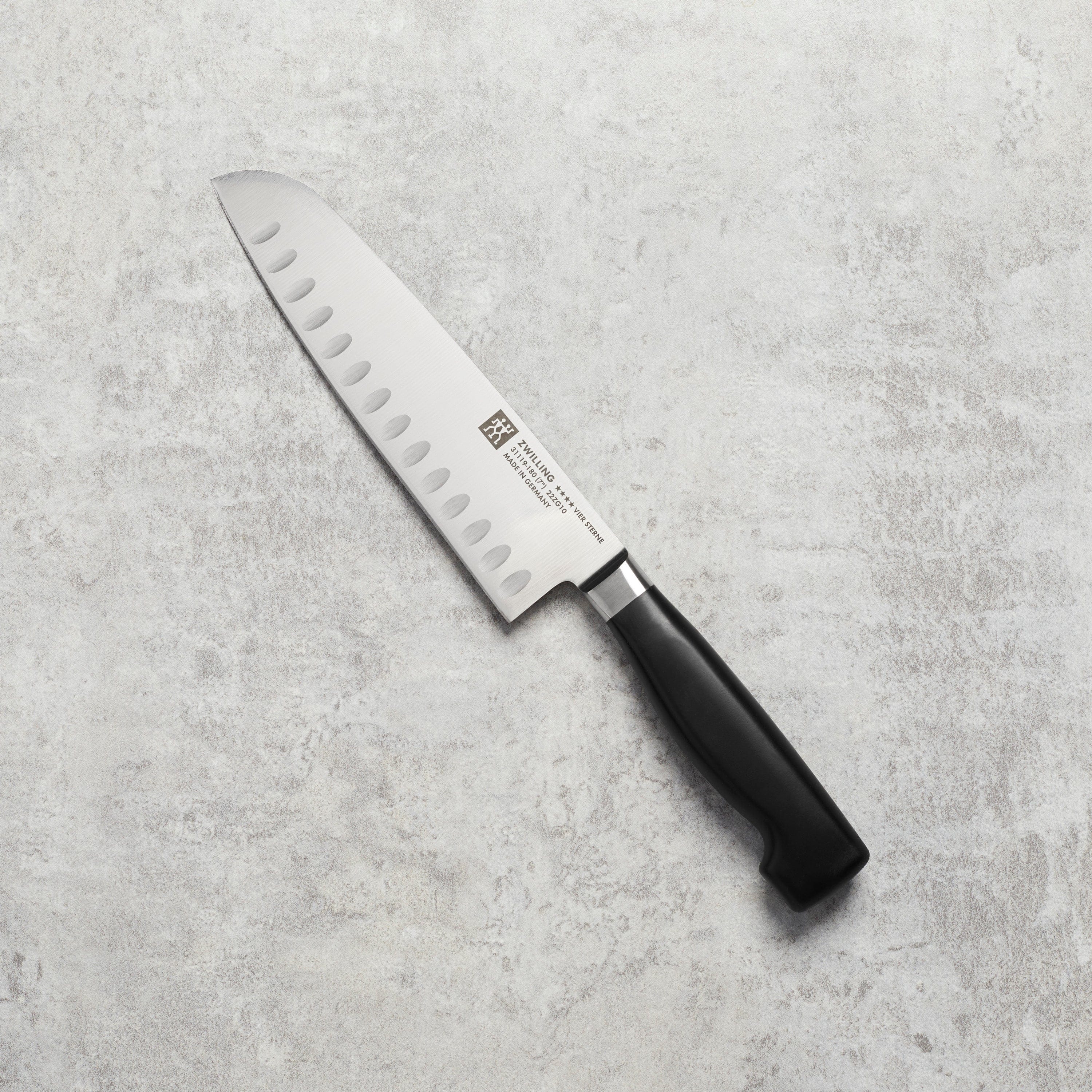 Zwilling Four Star 7-inch Hollow Edge Santoku Knife