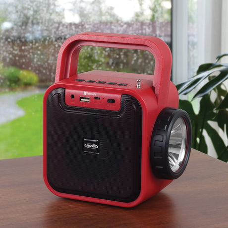 Jensen Portable Rechargeable Bluetooth Speaker with FM Radio, Flashlight, Solar Panel, and USB Port, Red, JEP-175
